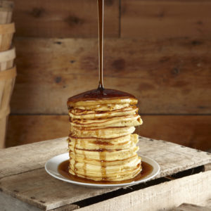 Syrup Pouring over Pancakes